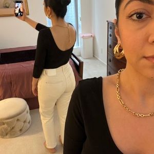 Guess body suit with 3/4 sleeve and open round neck